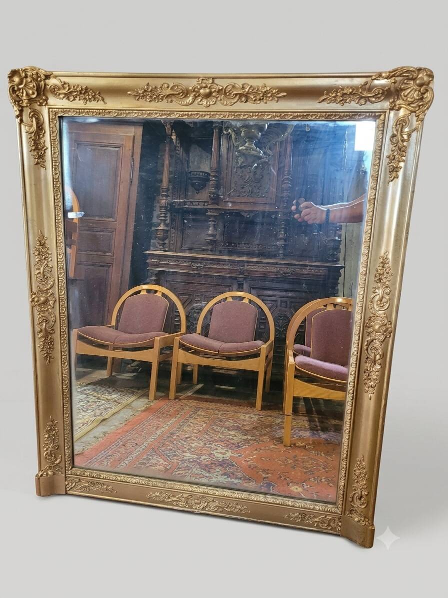 Antique gilded mirror from the 19th century, mercury mirror.