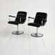 Pair of European 1970s swivel armchairs in faux leather and steel