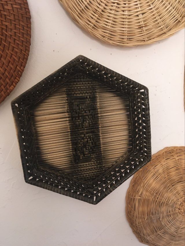 Wall composition of 9 wicker baskets and trays.