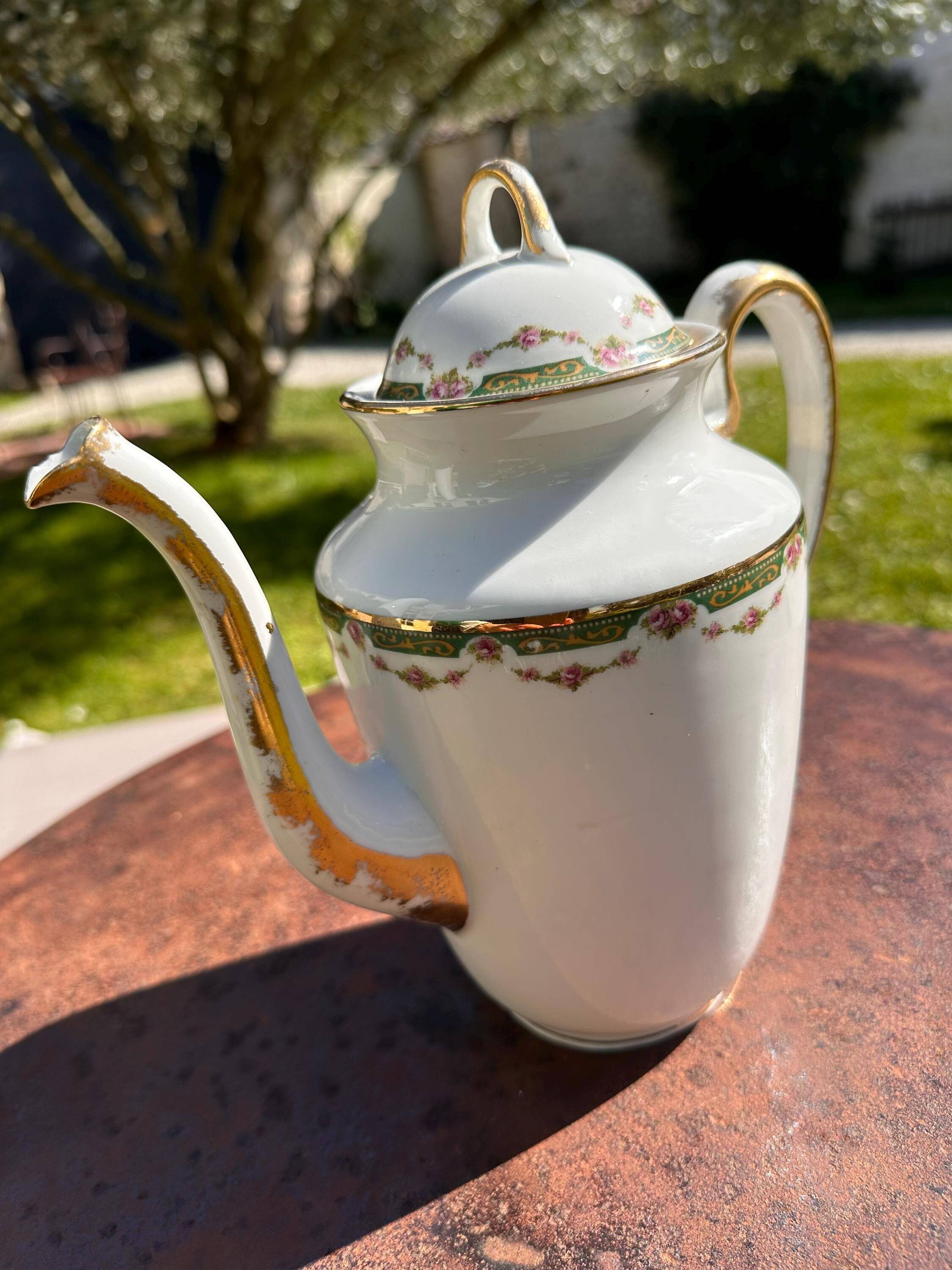 Set of jug, sugar bowl, and milk jug in Limoges porcelain by Paul Past.