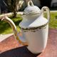 Set of jug, sugar bowl, and milk jug in Limoges porcelain by Paul Past.