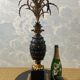 Large pineapple table lamp in carved black and gold wood, France, early 20th century.