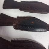 Antique wooden knife rests.