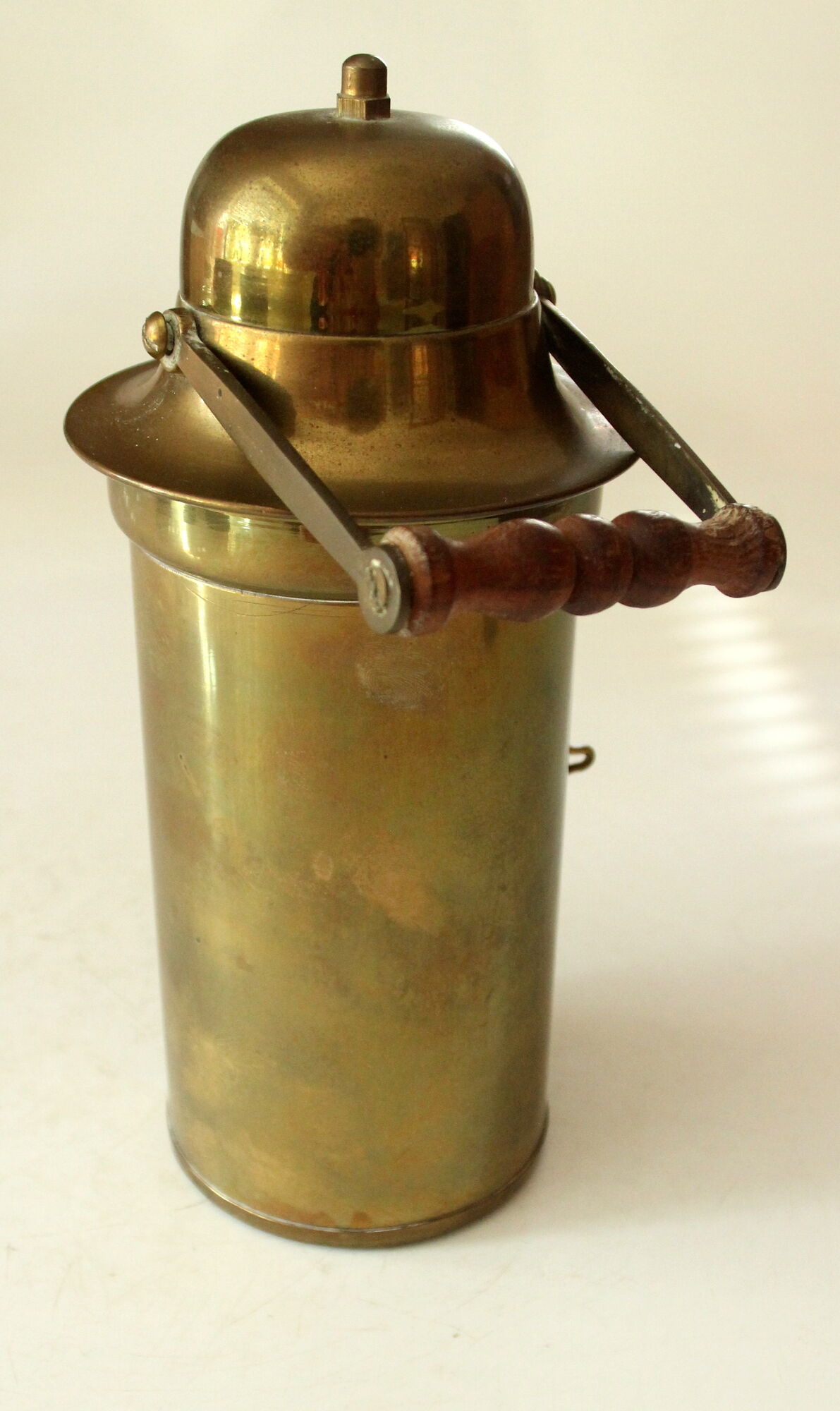 Decorative brass and glass oil lamp, wind light with wooden handle, vintage from the 1970s