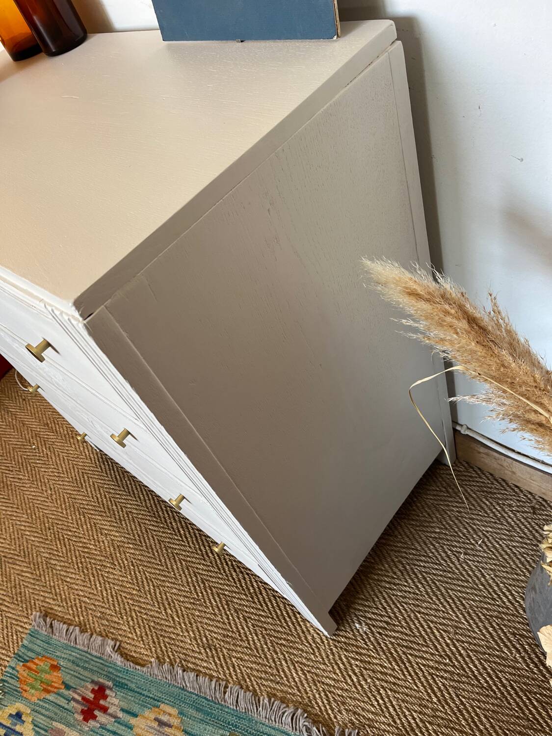 Restored wooden art deco chest of drawers with gilded handles