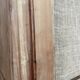 Large antique wardrobe made of wood and burlap.
