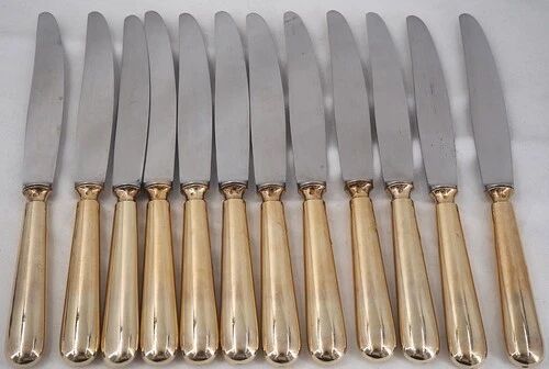 12 table knives model Baguette, golden handles, excellent condition.