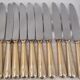 12 table knives model Baguette, golden handles, excellent condition.