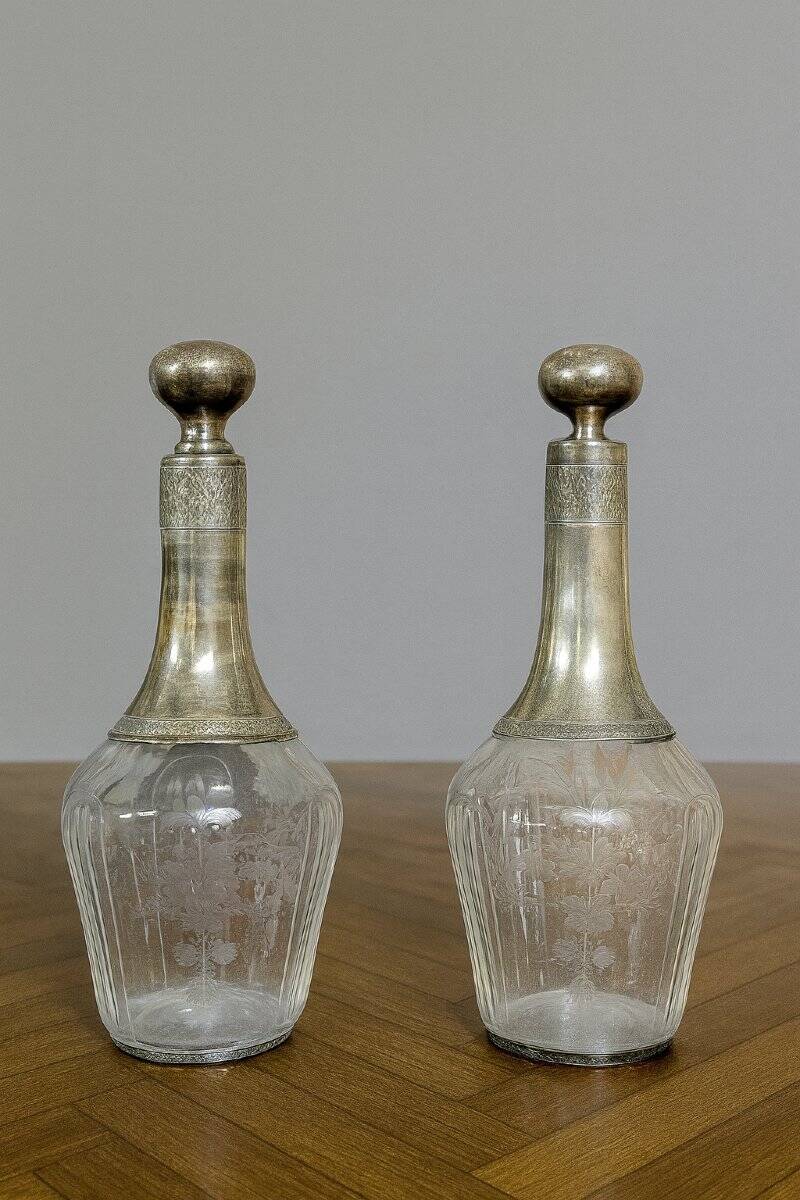 Pair of antique crystal and solid silver decanters.