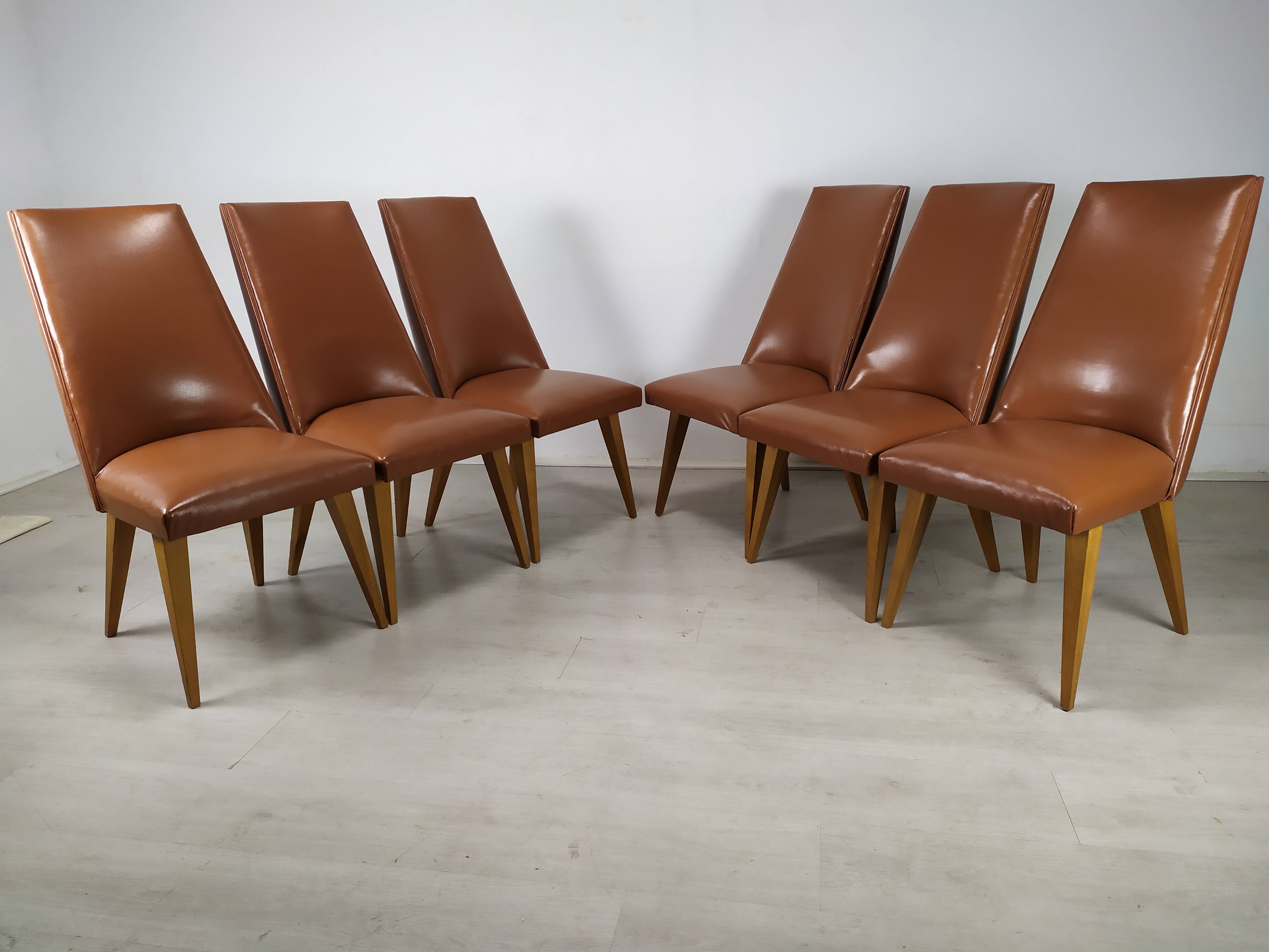 8 brown skai chairs 1950
