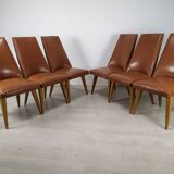 8 brown skai chairs 1950