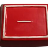 Set of three red ceramic ramekins