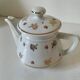 Porcelain teapot Louis Lourioux, decorated with roses and pyroluxe gilding.