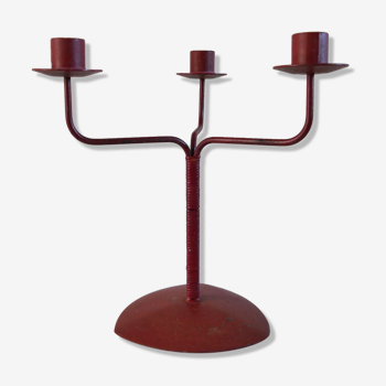 Red metal chandelier for three candles