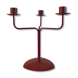 Red metal chandelier for three candles