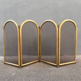 Antique brass fireplace screen from 1920, vintage spark guard.