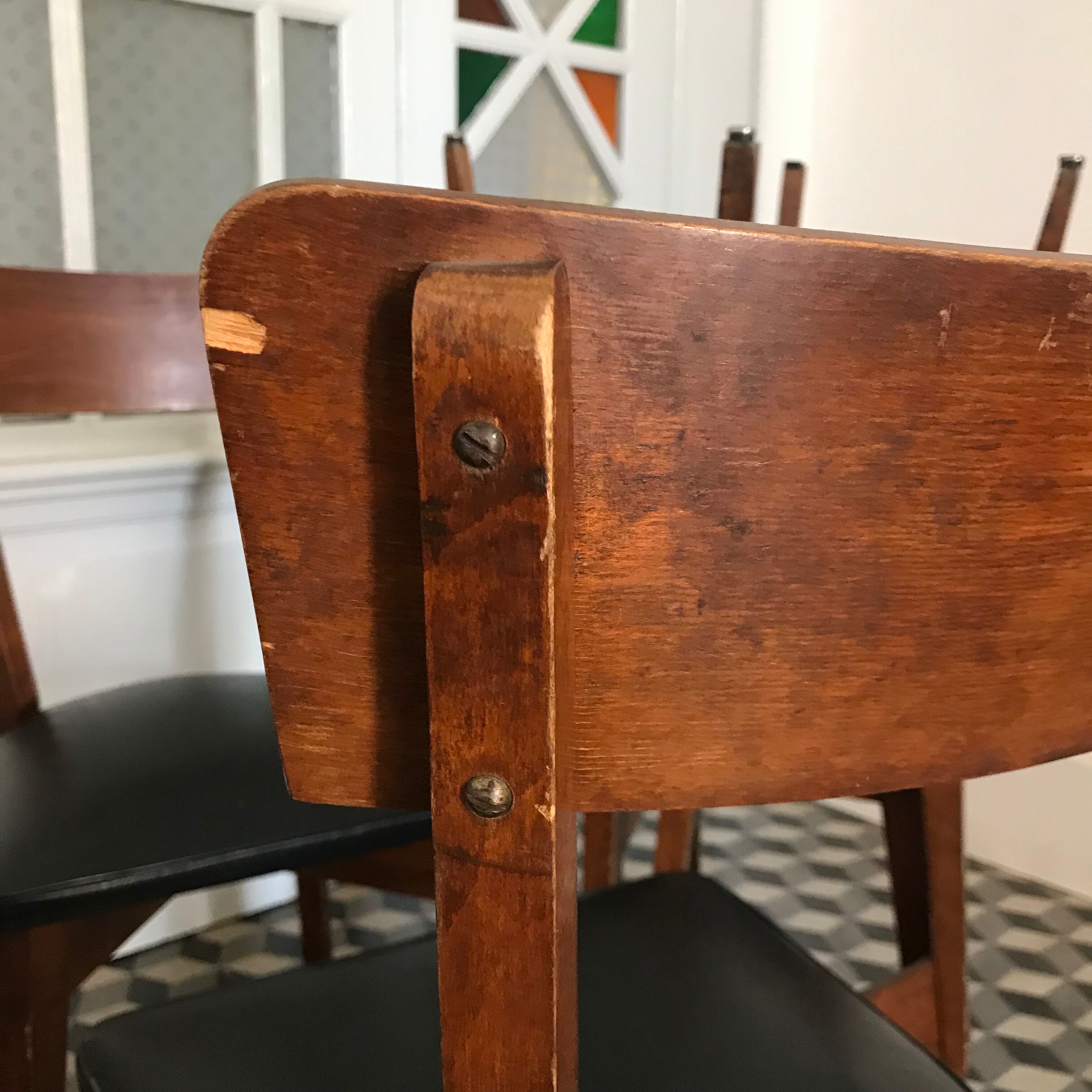 Vintage wooden and black skai chairs