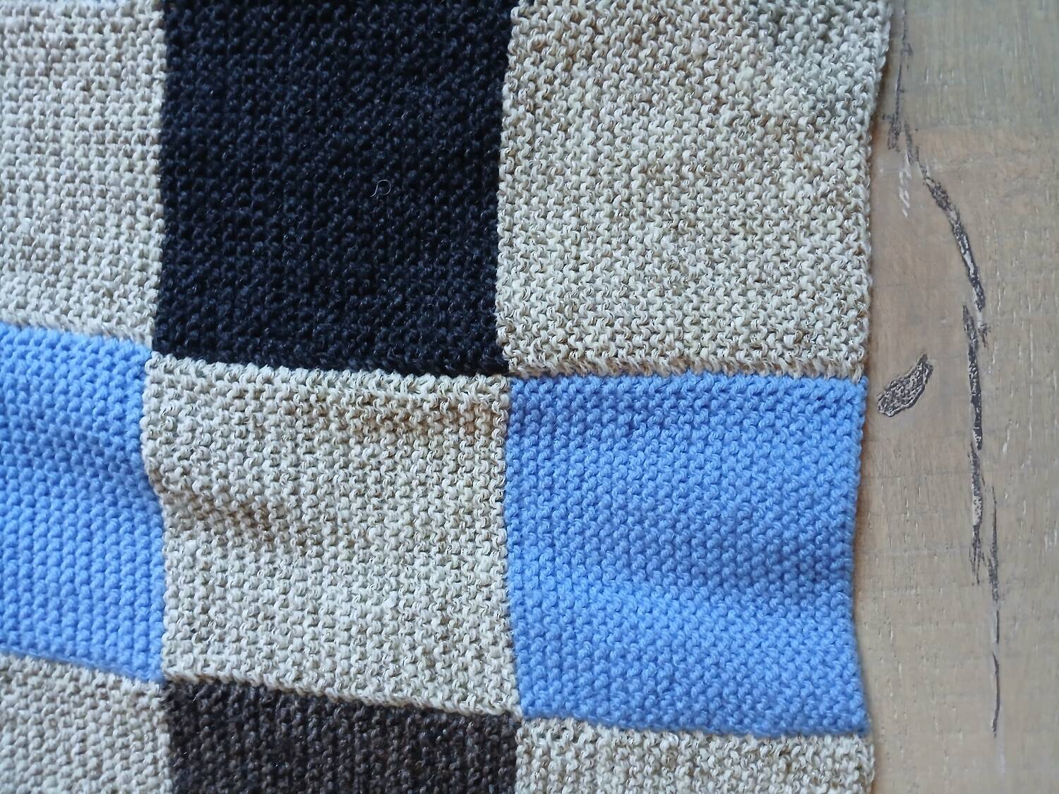 Hand knitted patchwork plaid