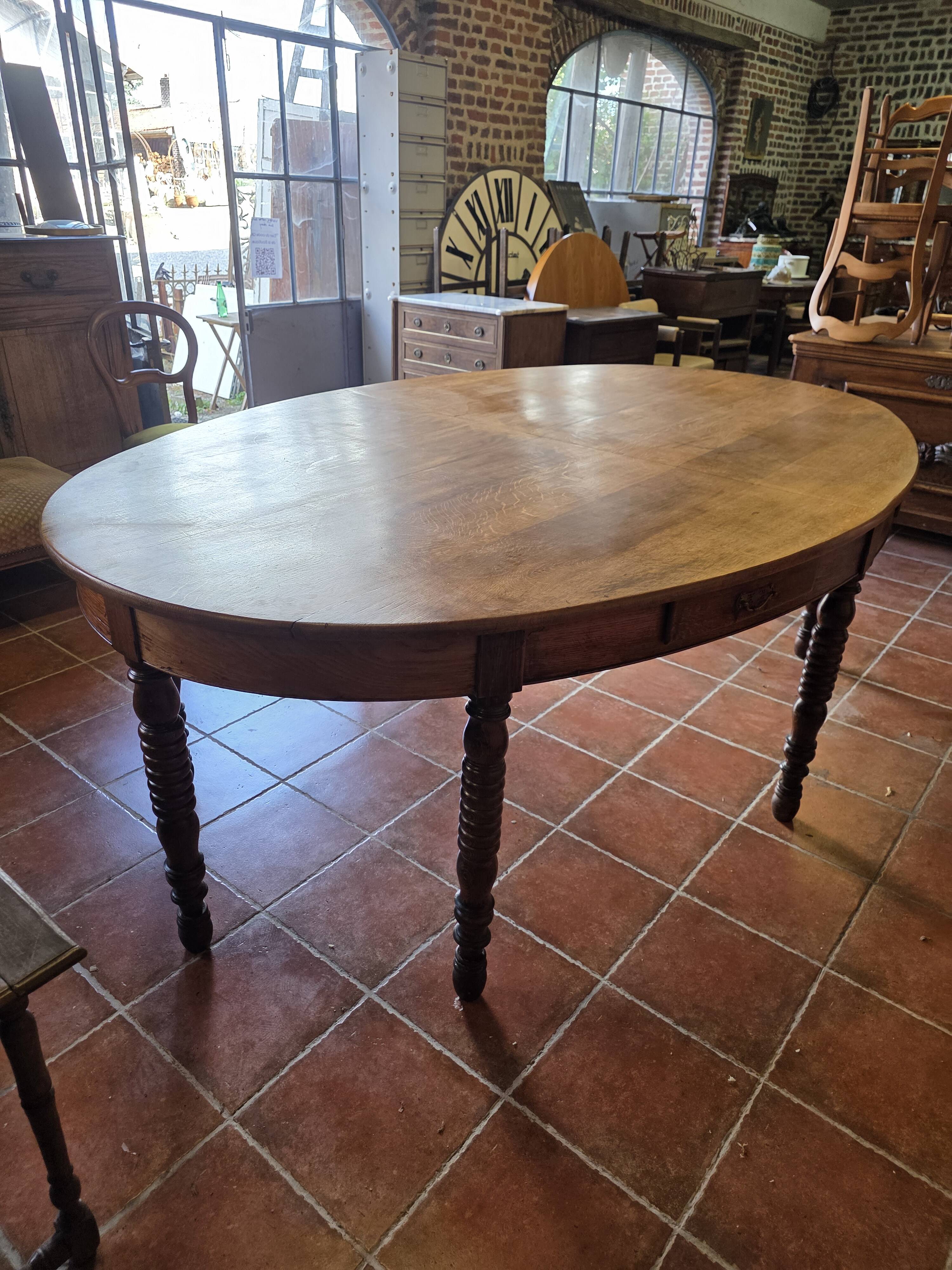 Large oval farmhouse table in solid oak, 19th century, 243 × 153cm