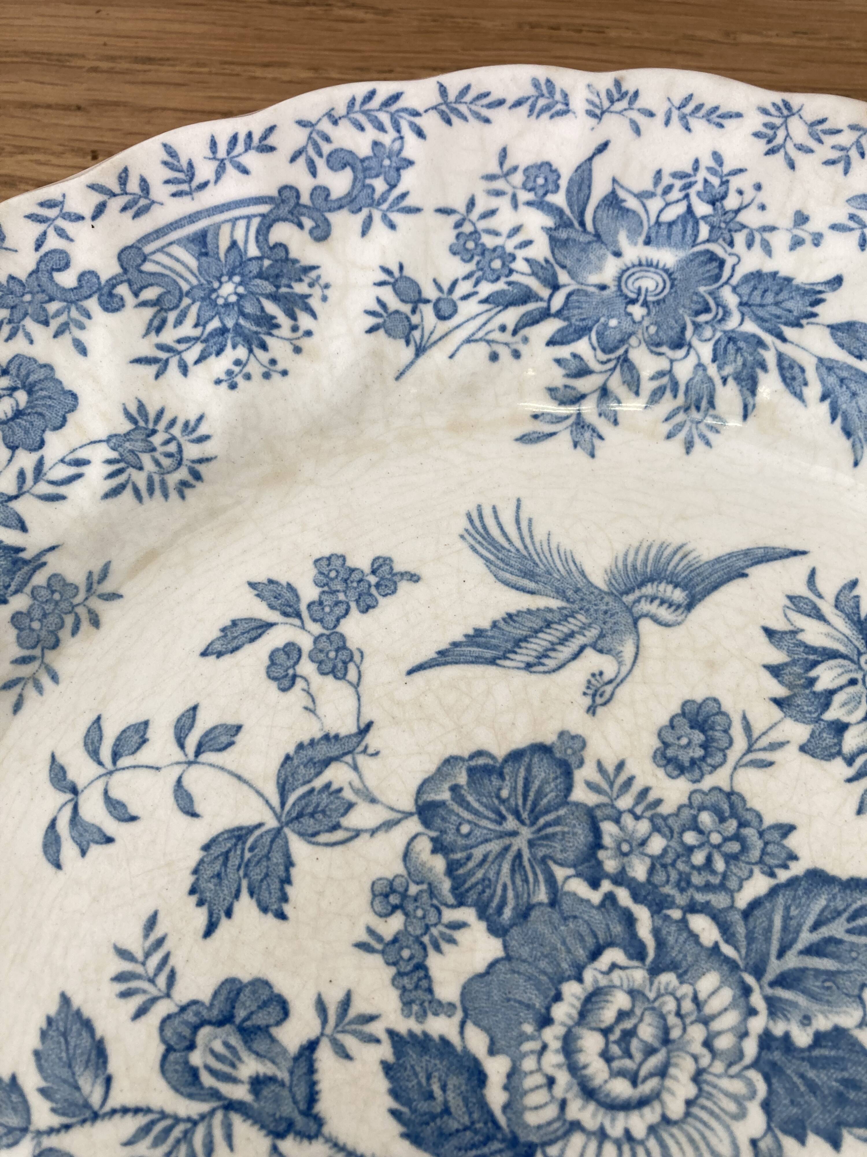 Four old blue plates