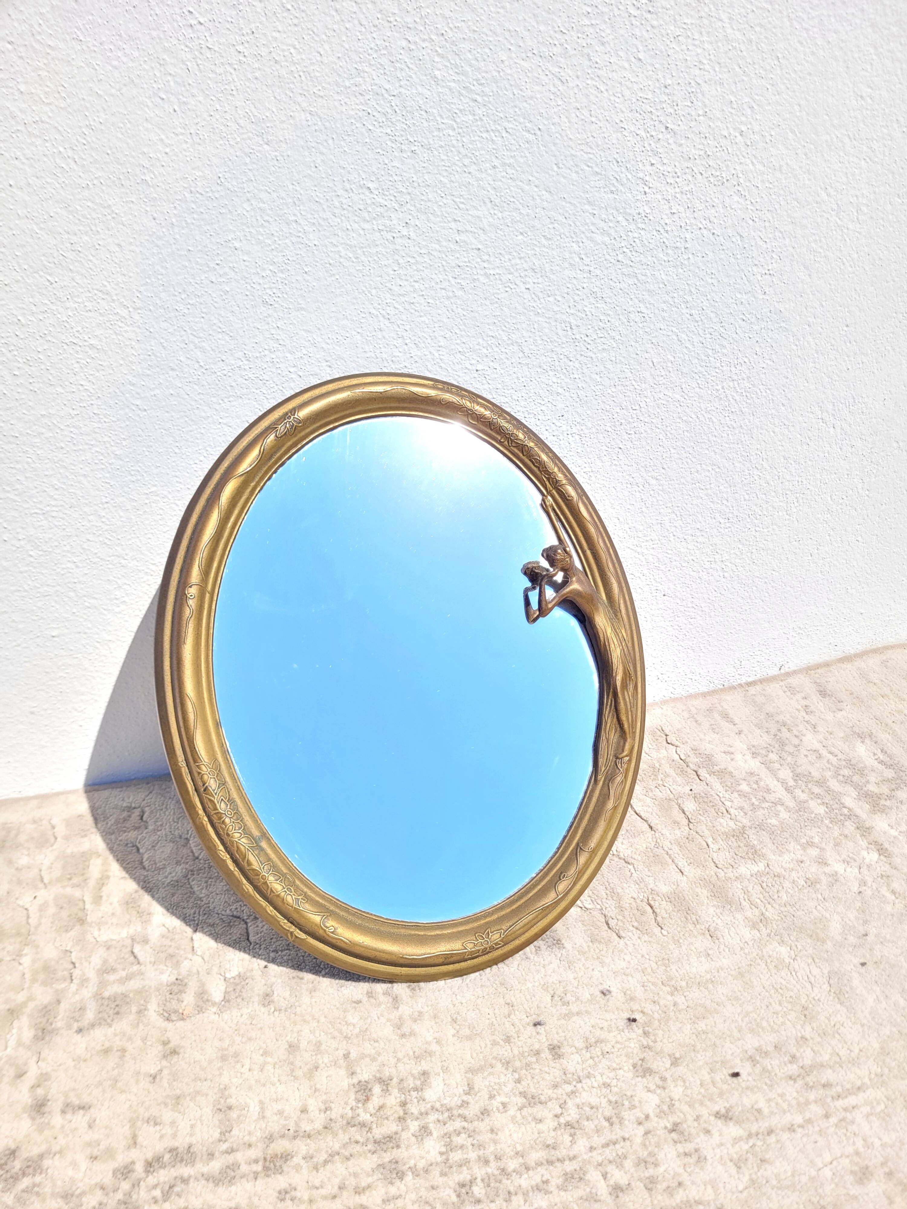 Oval mirror in gilded brass, Belle Époque style