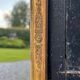 Miroir Empire en bois stuqué et doré, début XIXème siècle