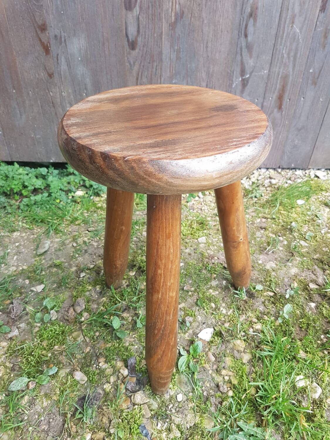 Old vintage wooden tripod milking stool