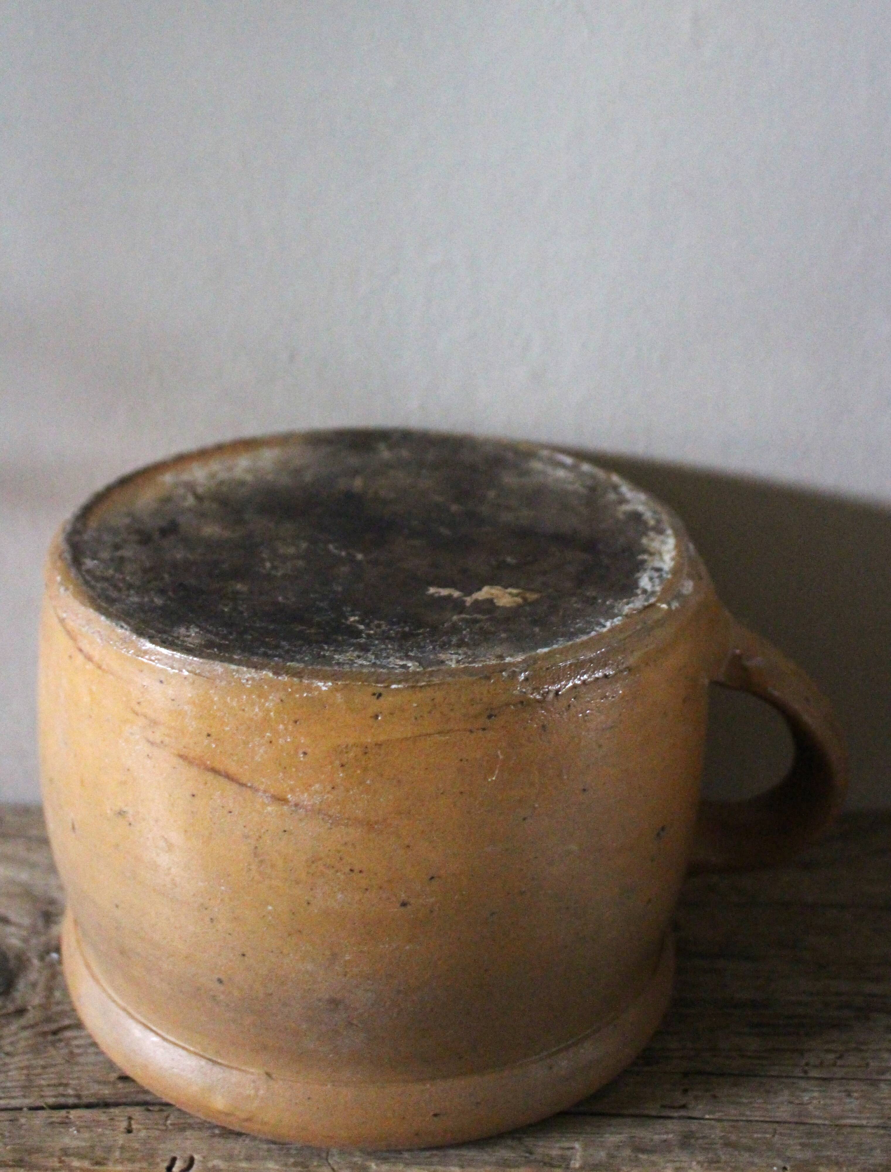 Round terracotta milk jug with handle