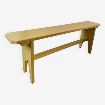 Yellow painted wooden bench