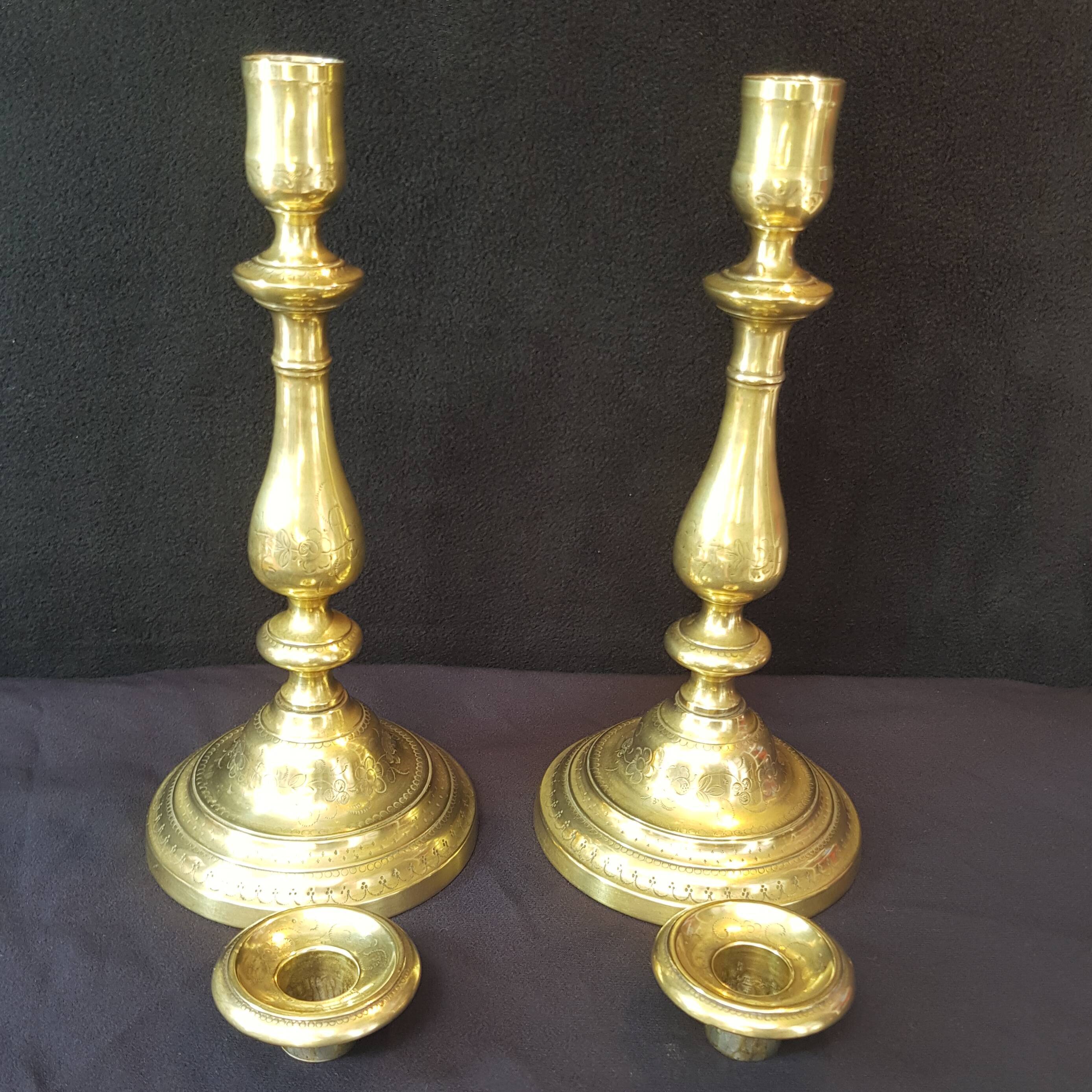 Chiseled gilded metal candlesticks