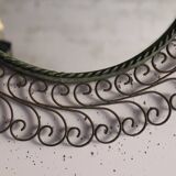 Large round vintage mirror in black metal with green patina