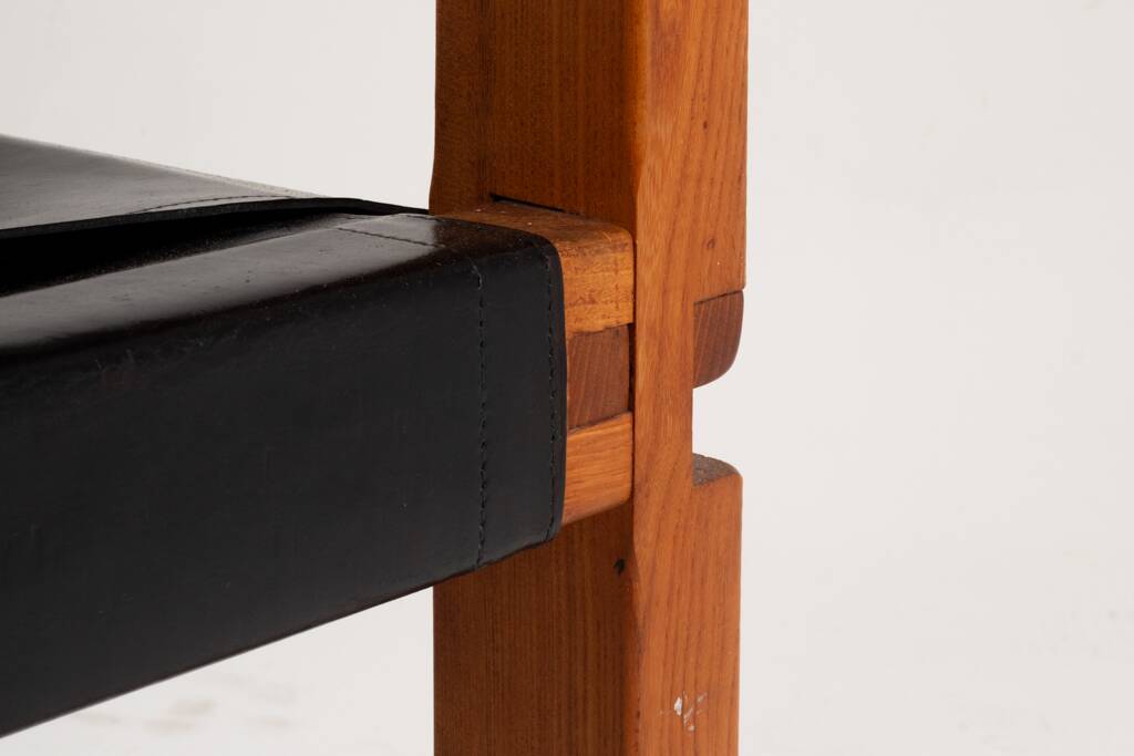 Pierre Chapo. Series of 8 "S11" chairs in elm and leather. 1960s-70s.