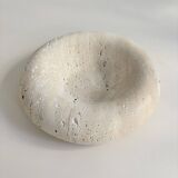 Travertine donut-shaped pocket emptier
