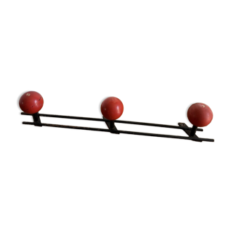 Coat rack with 3 red wooden balls