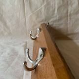 Vintage wooden wall-mounted coat rack with three double hooks