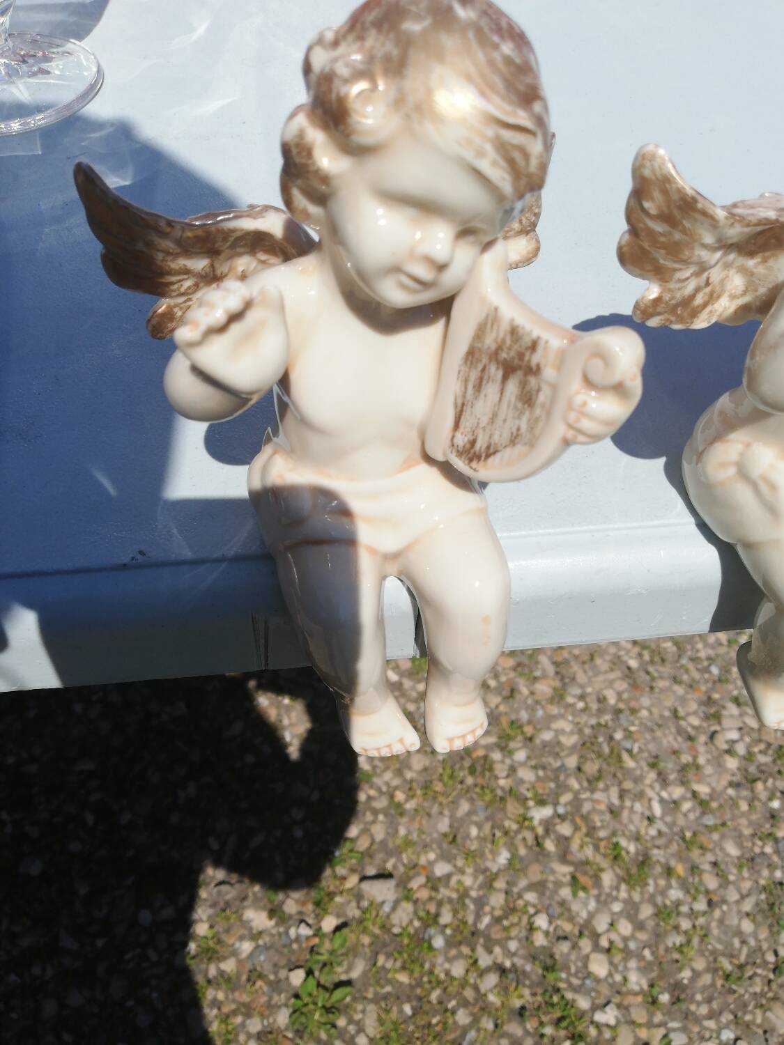 Pair of sitting angel statuettes