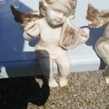 Pair of sitting angel statuettes