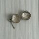 2 light metal shell cups