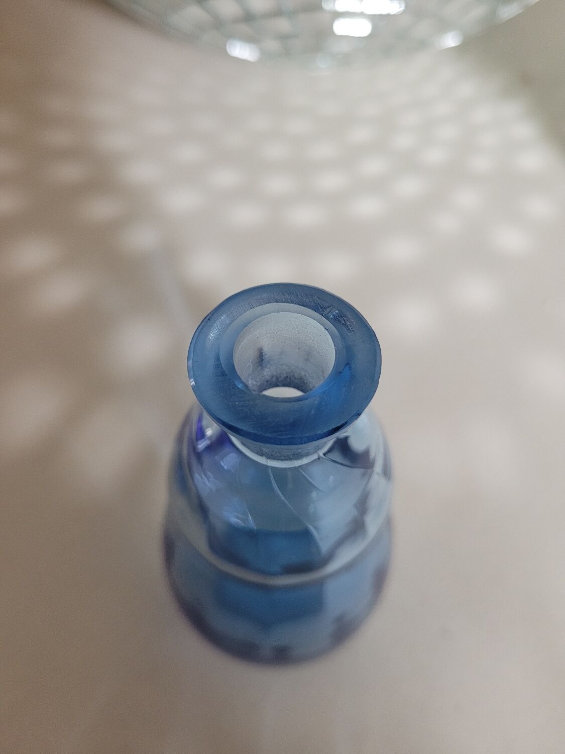 Small blown blue glass bottle