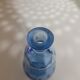Small blown blue glass bottle
