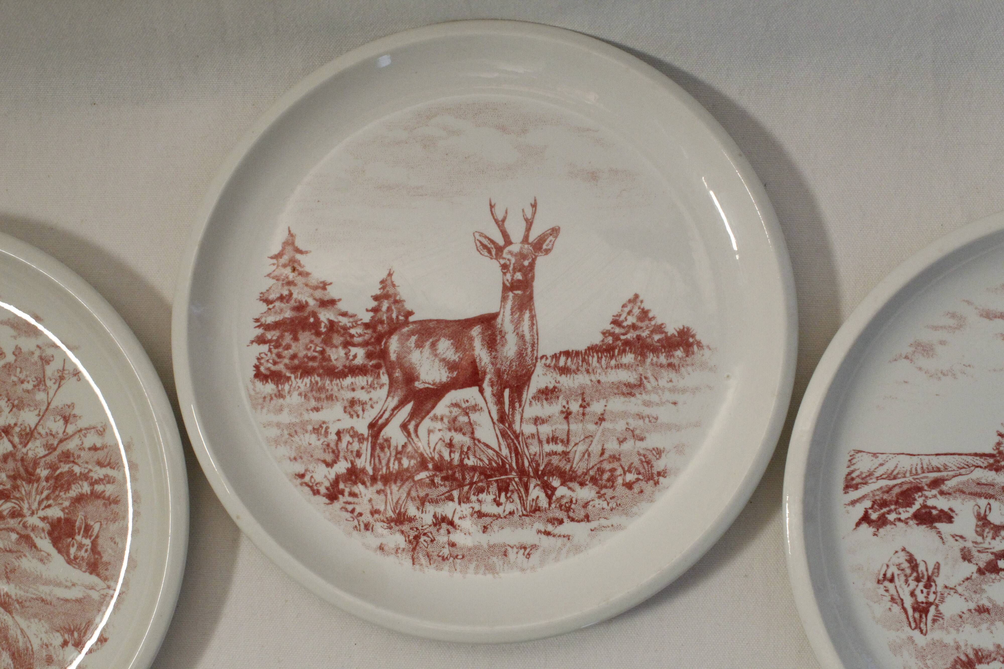 Set of 3 mismatched flat plates - red/burgundy decorations - deer and hare