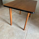 Mid-century coffee table with tapered legs.