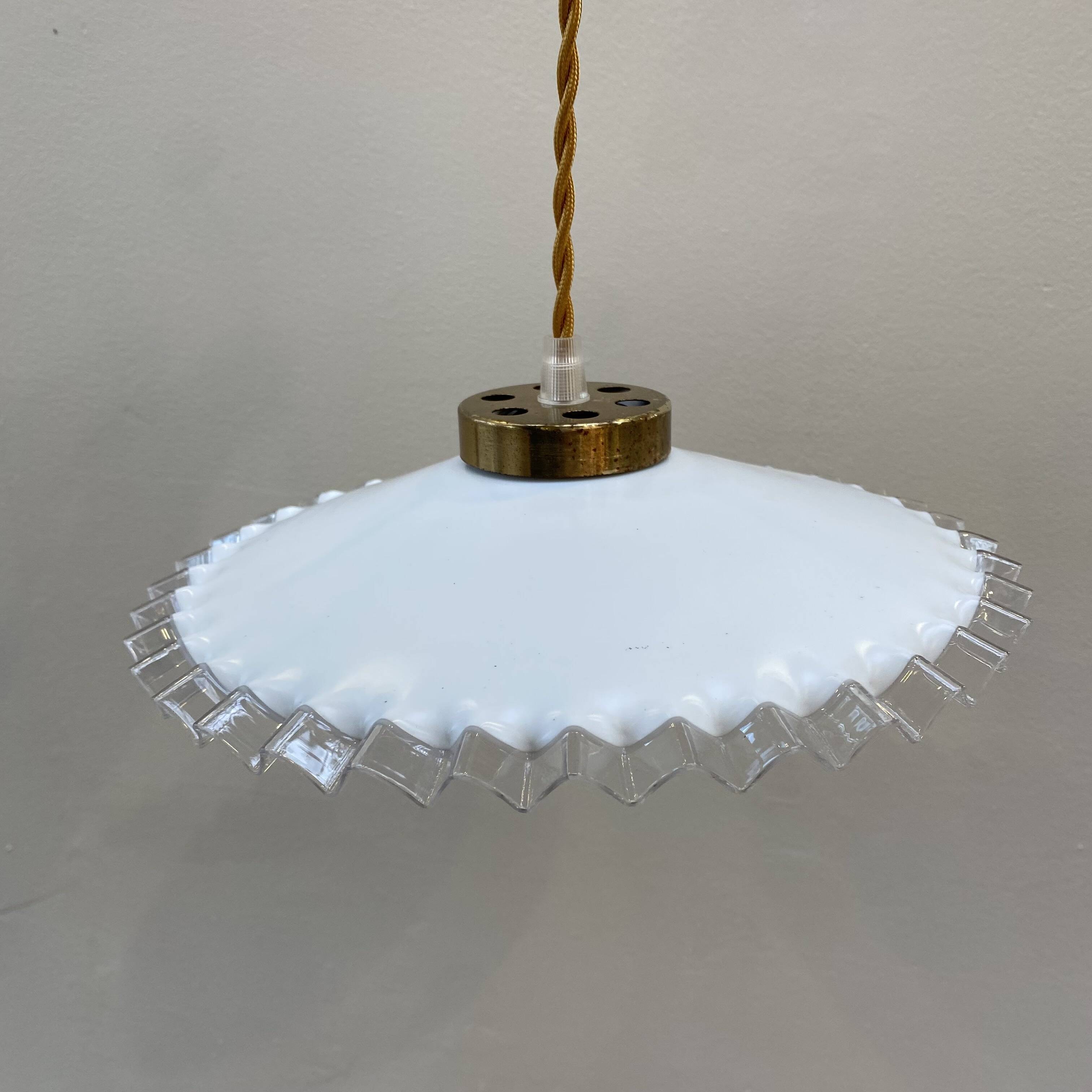 White opaline pendant light with transparent serrated edges