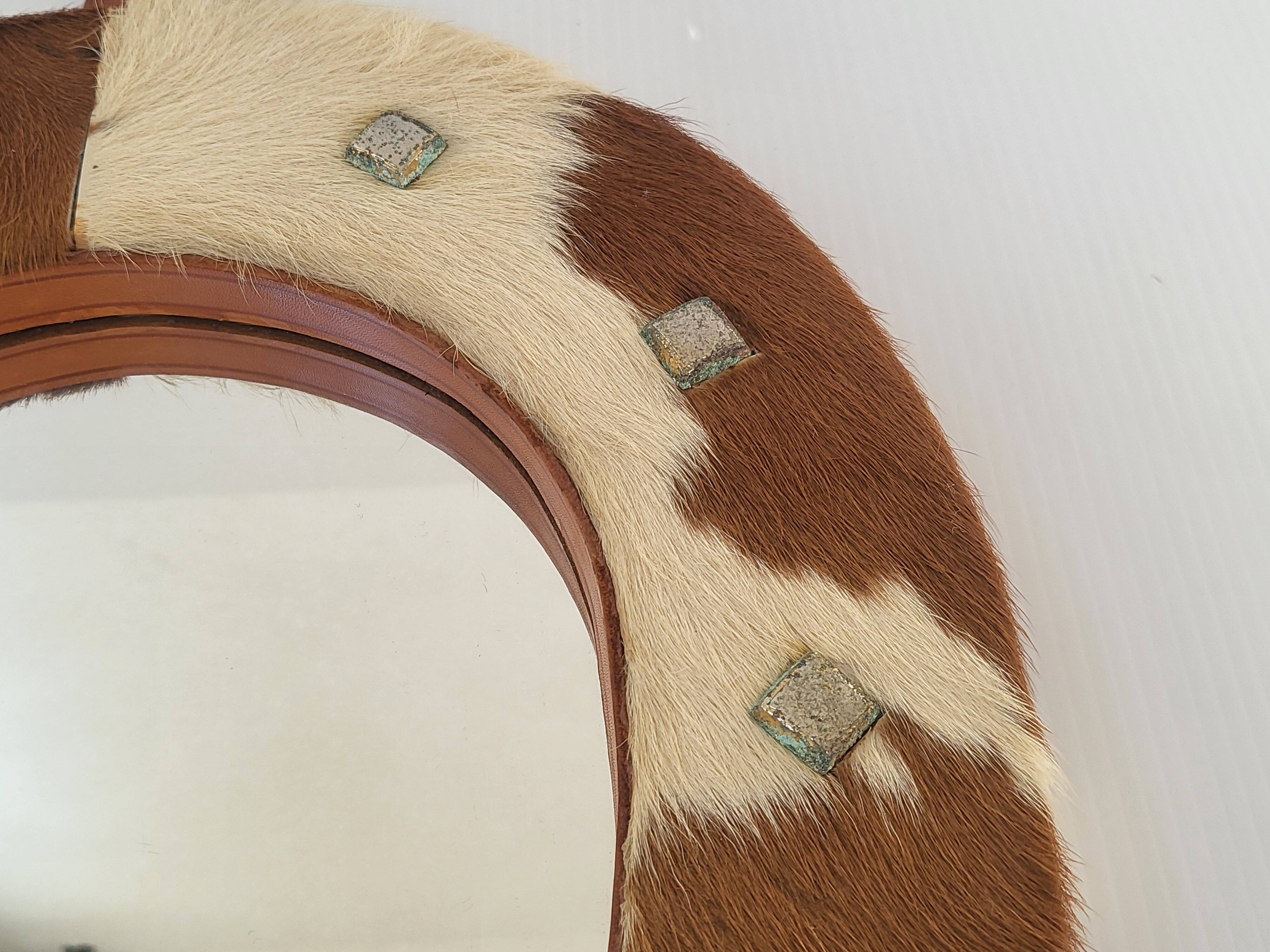 Vintage 1970s cowhide horseshoe mirror