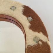 Vintage 1970s cowhide horseshoe mirror