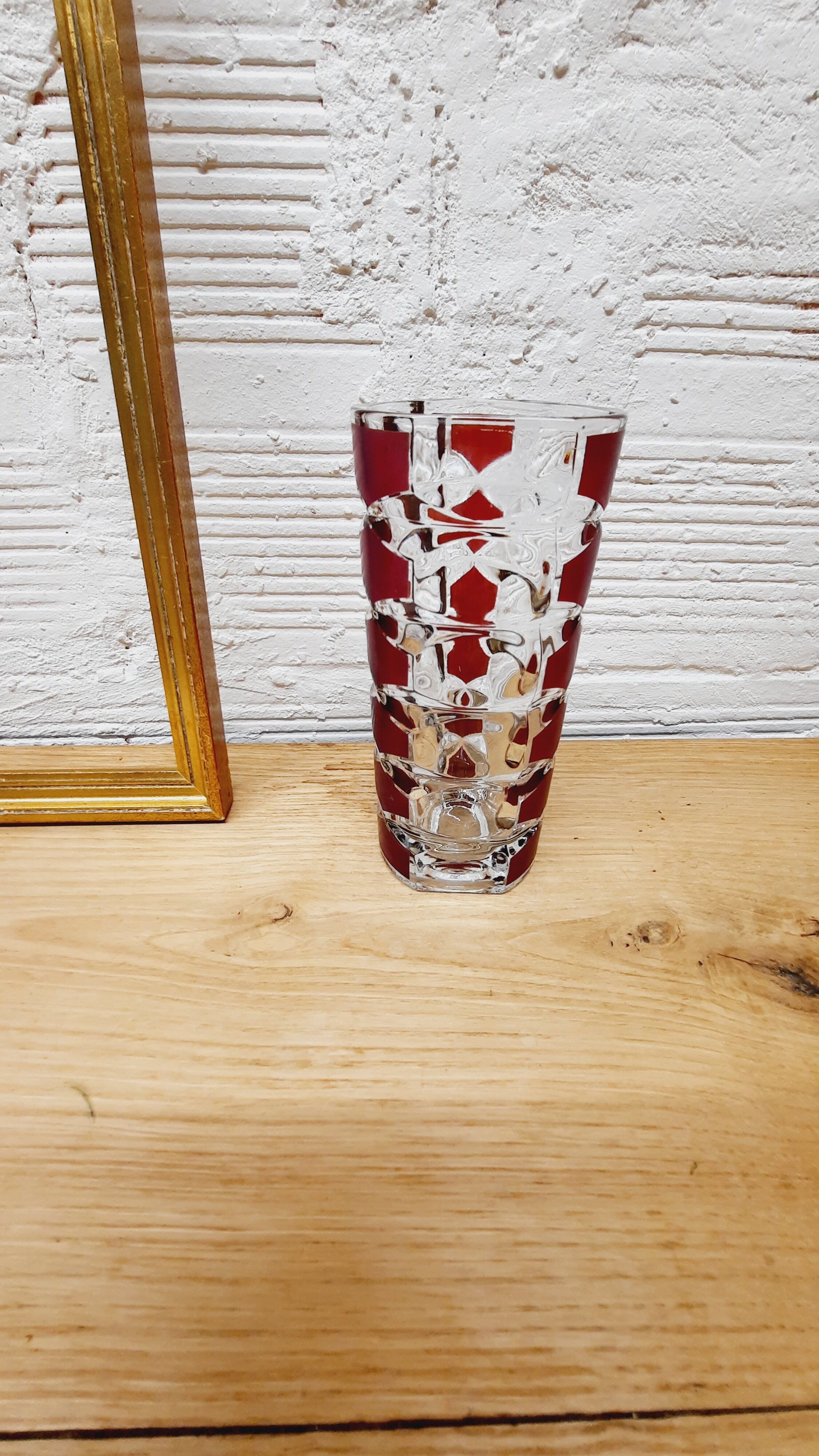 Glass vase with colored facets