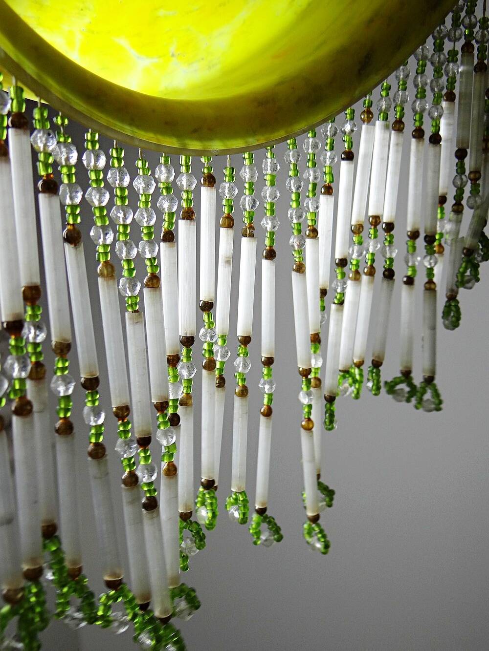 Antique Art Deco lampshade in yellow marbled glass with bead fringes.