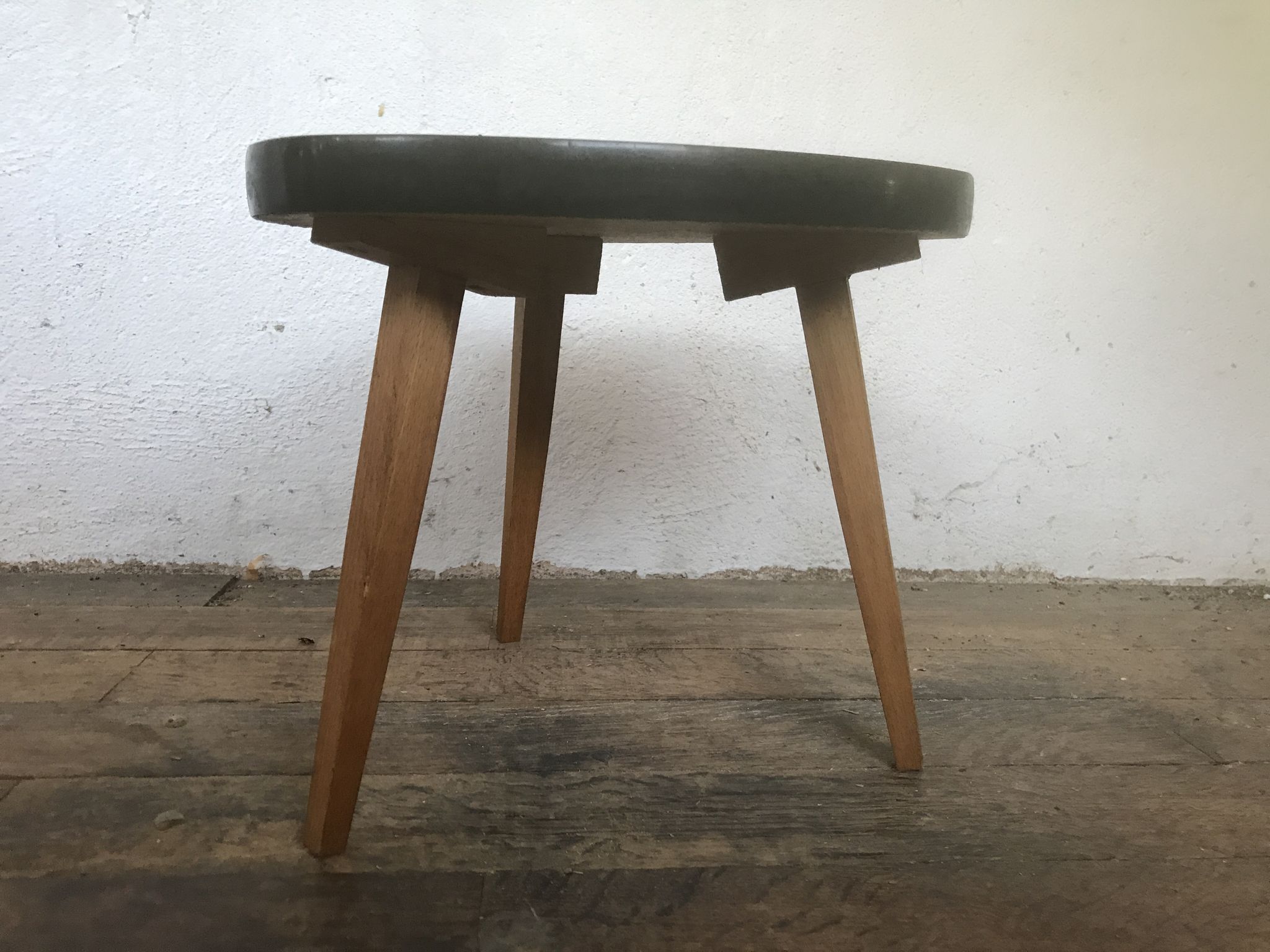 Small triangular table coffee table with a vintage tripod door midcentury plant 1950