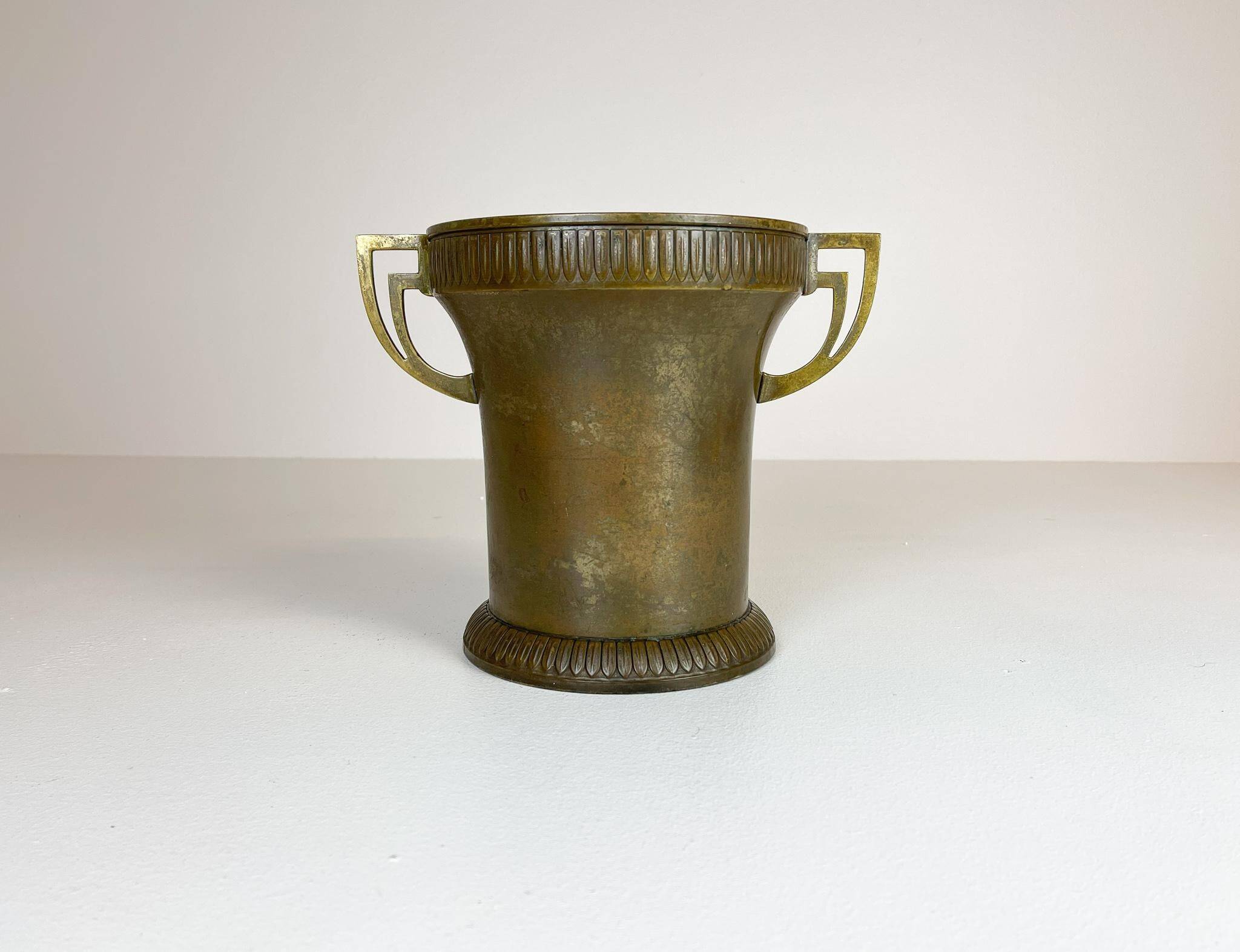 Art Deco champagne cooler in copper and brass with relief patterns, Sweden, 1930s.