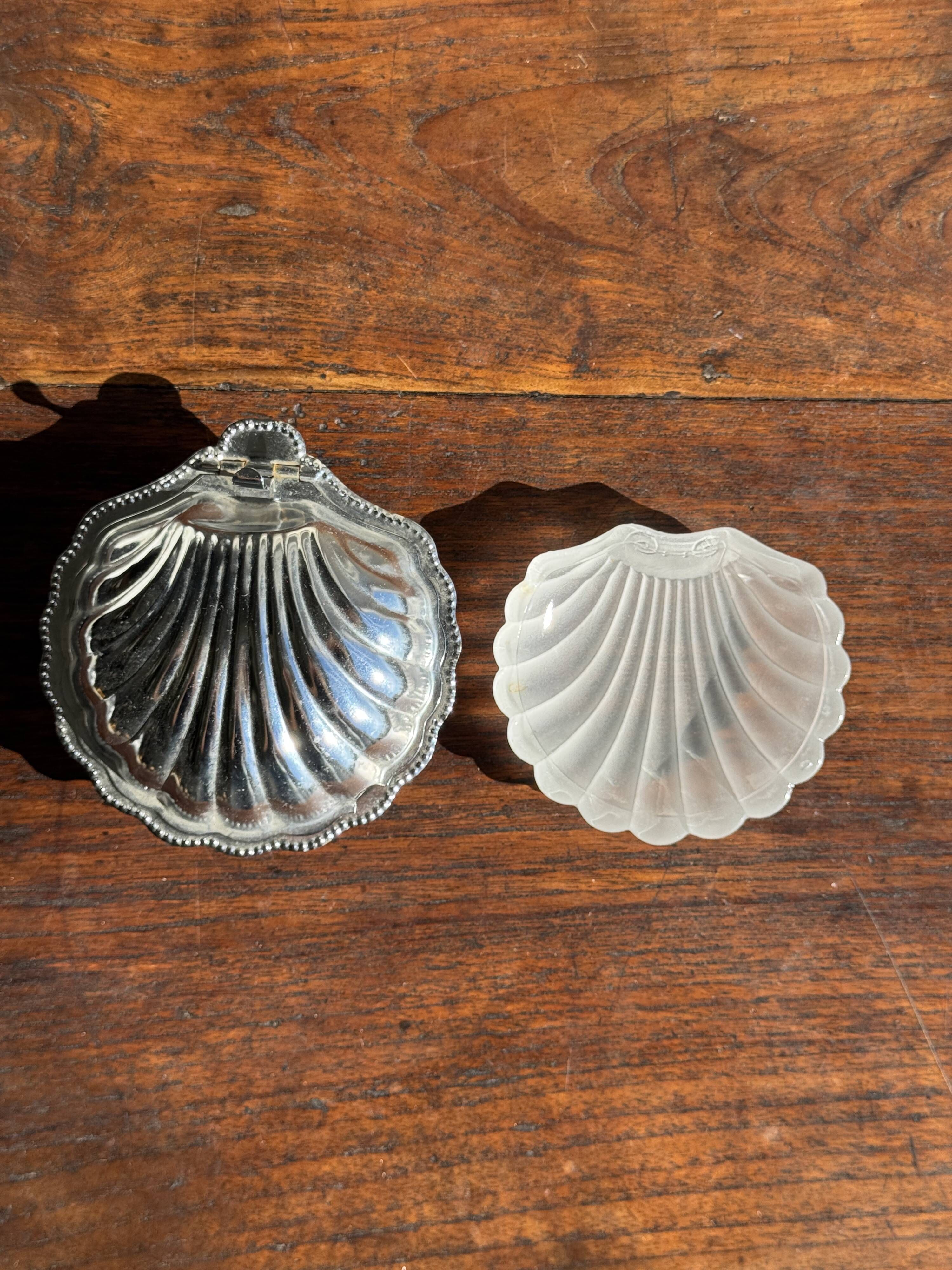 Vintage silver-plated shell butter dish with transparent bowl.